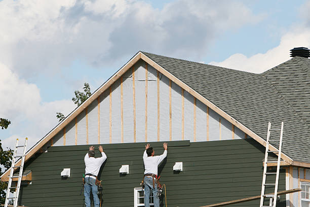 Professional Siding Installation technician working in Andover, MA